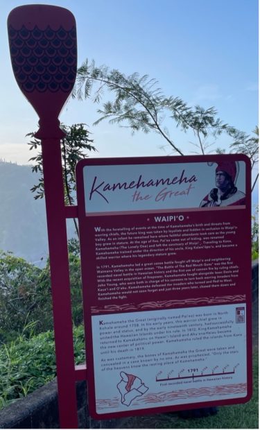 A sign telling the story of Kamehameha the Great at Waipi'o Valley.