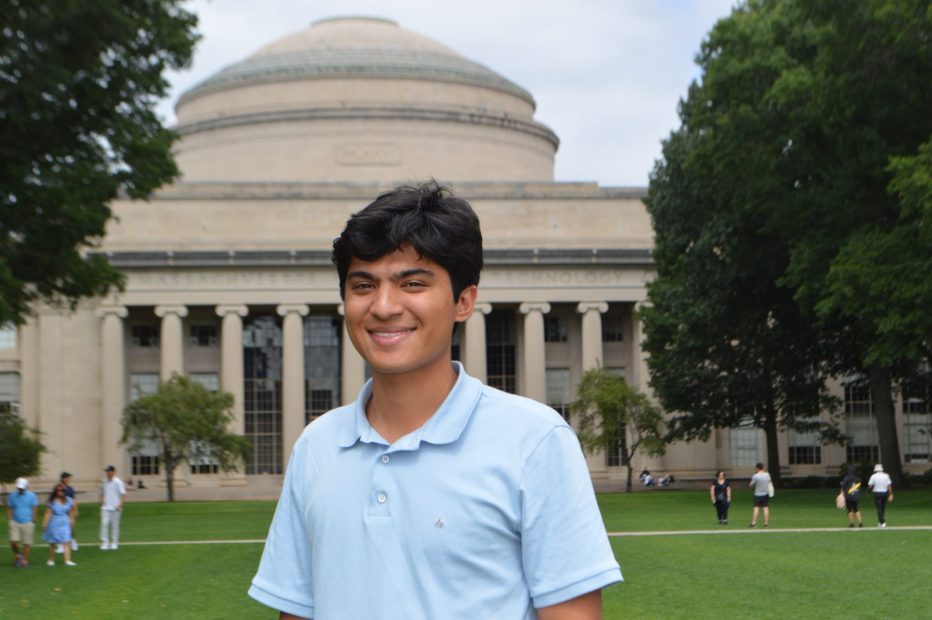 Headshot of Jevan Yu standing in front of the Dome in Killian Court.