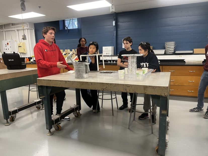 Josh Woren, Haylea Brock, Sheila Nguyen, and Tananya Prankprakma present their initial prototype to the class.