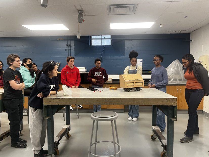 Wonu Abiodun, Megan Eaton, and Joyce Yambasu present their initial autonomous dumpster prototype.