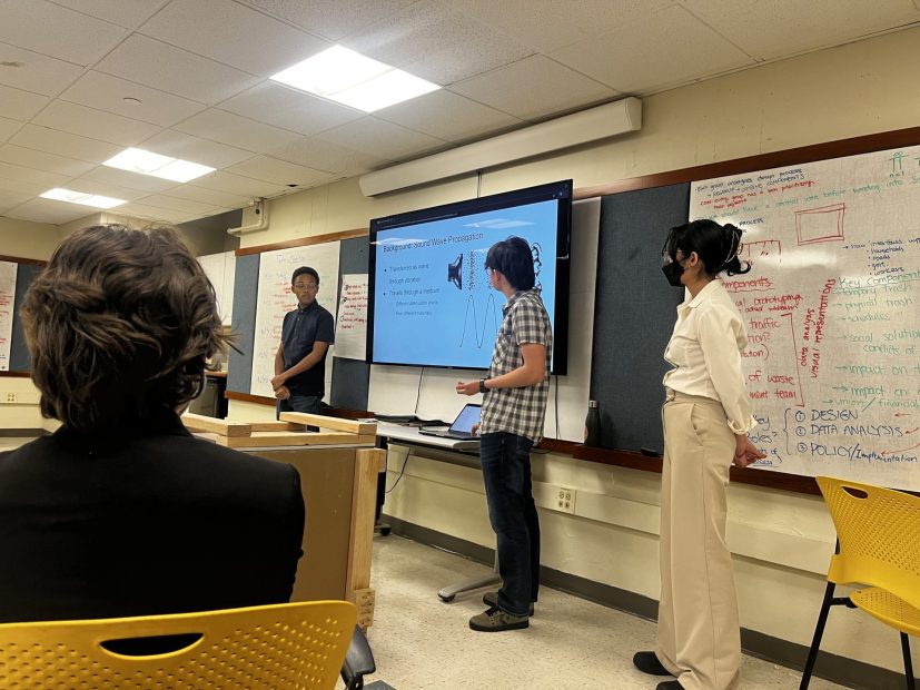 James Henriquez, Zack Ivanisevic and Rita Zambrano present their final prototype.