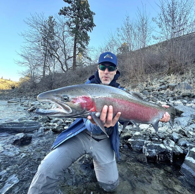 Sorenson, an avid fisherman, catching a big steelhead in Idaho’s Clearwater River.